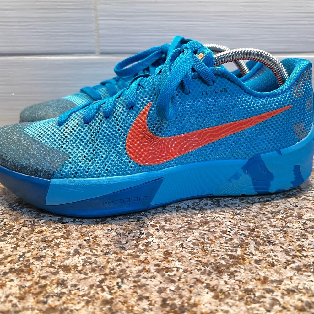 Nike men’s Bright Blue Sneakers with Orange Swoosh